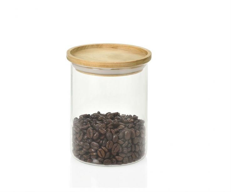 Bote de cristal y tapa de madera de bambú pequeño con café en grano